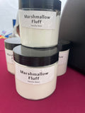 a stack of marshmallow fluff jars