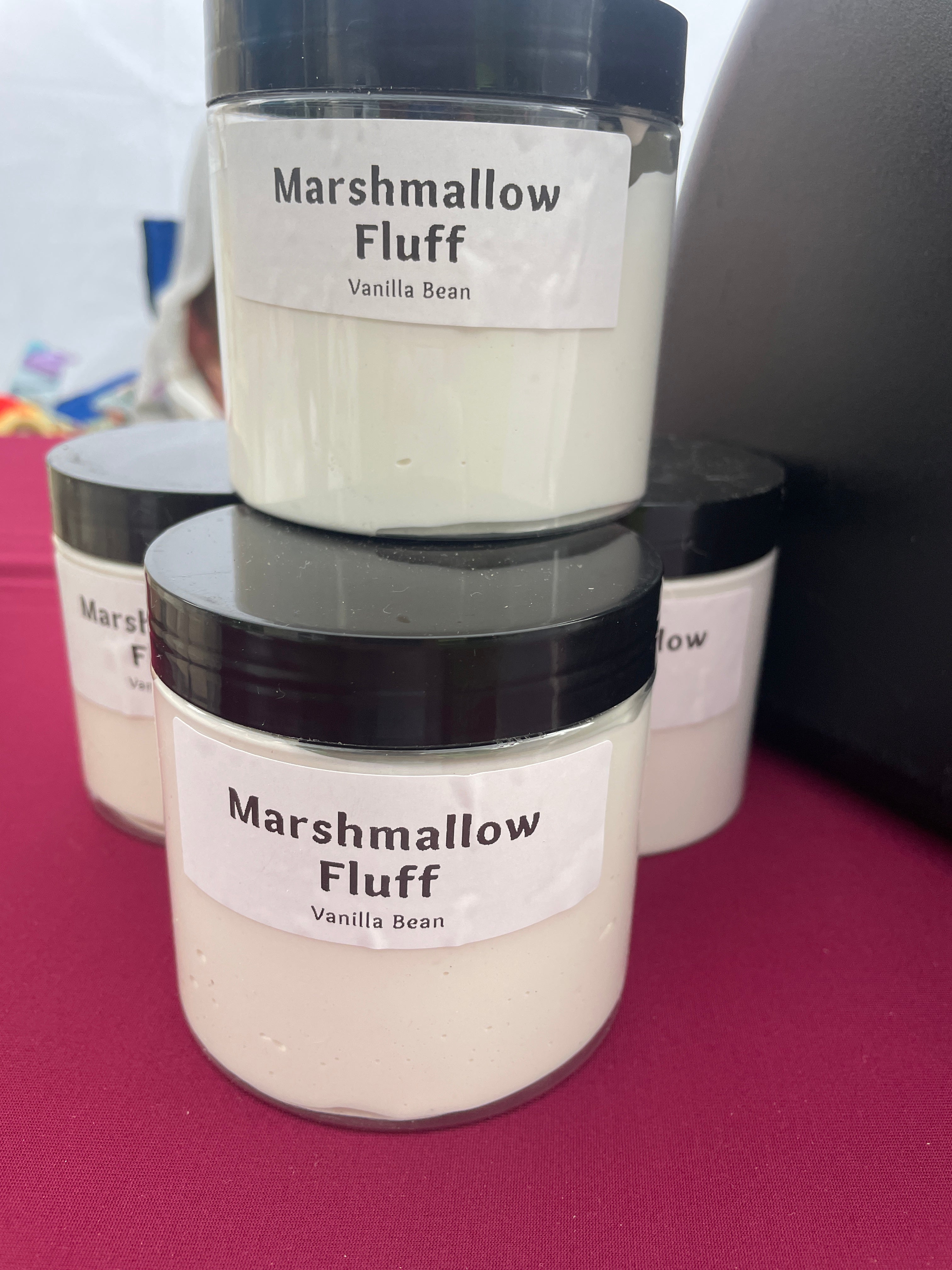 a stack of marshmallow fluff jars