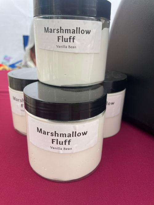a stack of marshmallow fluff jars